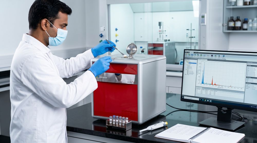 Auriga Research analyst operating an ICP-MS elemental analyser — used for ICH Q3D(R2) elemental impurity testing across 24 elements in a single run.